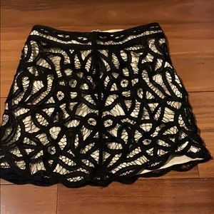 100% silk skirt. Black lace with beige lace lining